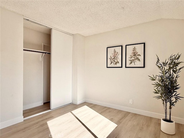 1850 Pritchard Way, Hacienda Heights, CA 91745 - unfurnished bedroom with wood finished floors, a textured ceiling, and a closet