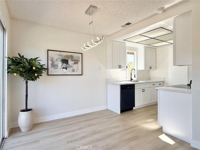1850 Pritchard Way, Hacienda Heights, CA 91745 - kitchen featuring dishwasher, light wood finished floors, a textured ceiling, light countertops, and white cabinetry