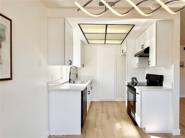 1850 Pritchard Way, Hacienda Heights, CA 91745 - kitchen with electric range, under cabinet range hood, dishwashing machine, light wood-type flooring, and light countertops
