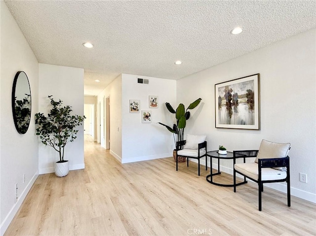 1850 Pritchard Way, Hacienda Heights, CA 91745 - sitting room with light wood-style flooring, a textured ceiling, and recessed lighting