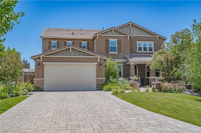 22348 Driftwood Ct, Saugus, CA 91350 - craftsman inspired home featuring a front yard, decorative driveway, stone siding, a garage, and board and batten siding