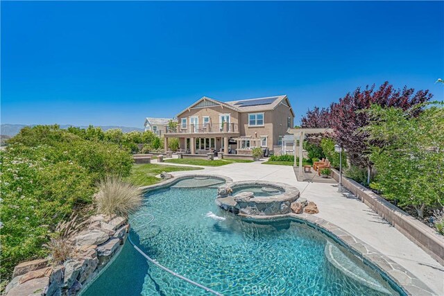 22348 Driftwood Ct, Saugus, CA 91350 - view of swimming pool with a patio and a pool with connected hot tub
