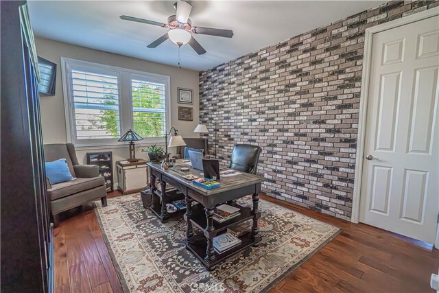 22348 Driftwood Ct, Saugus, CA 91350 - office space featuring brick wall, a ceiling fan, wood finished floors, and an accent wall