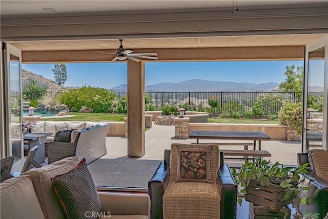 22348 Driftwood Ct, Saugus, CA 91350 - fenced backyard with a ceiling fan, a mountain view, a patio area, and an outdoor living space