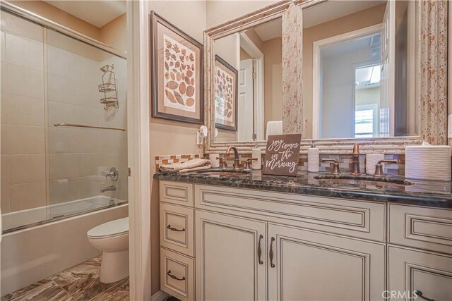 22348 Driftwood Ct, Saugus, CA 91350 - full bath with double vanity, shower / bath combination with glass door, marble finish floors, and decorative backsplash