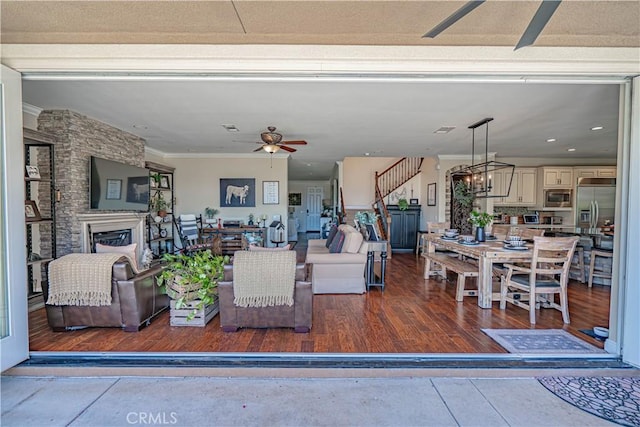 22348 Driftwood Ct, Saugus, CA 91350 - living area featuring a ceiling fan, ornamental molding, a fireplace, and recessed lighting