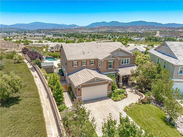 22348 Driftwood Ct, Saugus, CA 91350 - view of front facade with a mountain view, decorative driveway, stucco siding, and a garage
