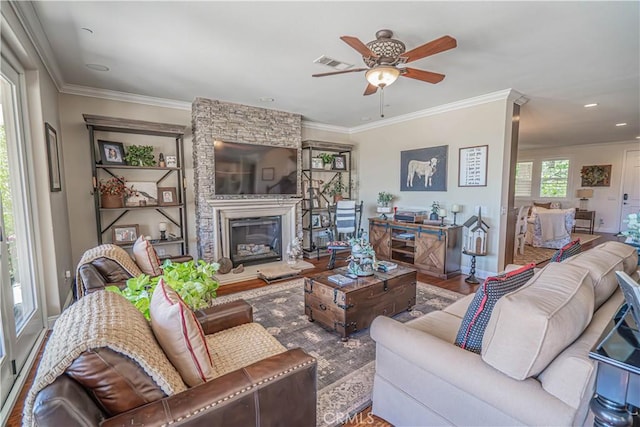 22348 Driftwood Ct, Saugus, CA 91350 - living area with a ceiling fan, a fireplace, crown molding, wood finished floors, and recessed lighting