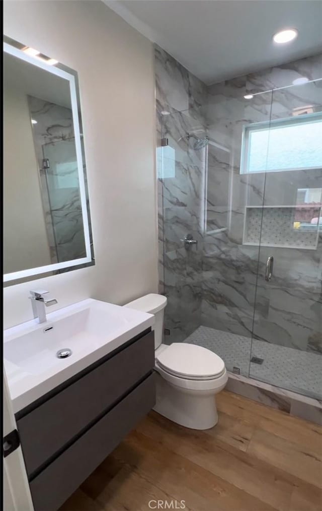 3520 Grand Ave, Huntington Park, CA 90255 - full bath featuring a marble finish shower, vanity, wood finished floors, and recessed lighting