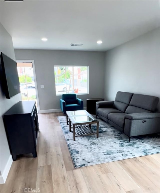 3520 Grand Ave, Huntington Park, CA 90255 - living area with light wood-style flooring and recessed lighting