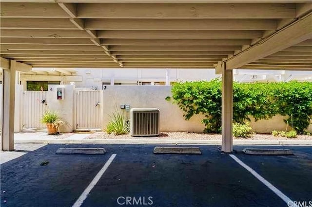 6105 Montecito Dr Unit 5, Palm Springs, CA 92264 - covered parking lot featuring a gate