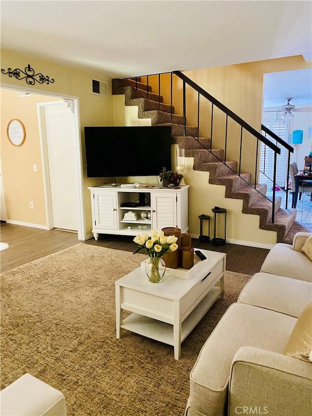 6105 Montecito Dr Unit 5, Palm Springs, CA 92264 - living room featuring stairs, wood finished floors, and ceiling fan