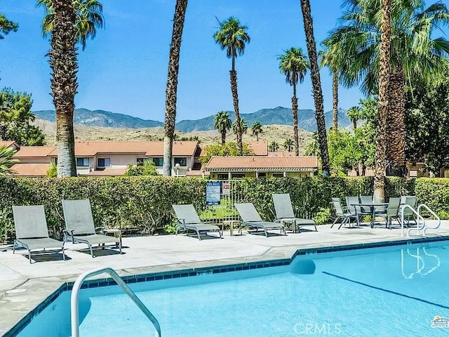 6105 Montecito Dr Unit 5, Palm Springs, CA 92264 - community pool with a mountain view and a patio