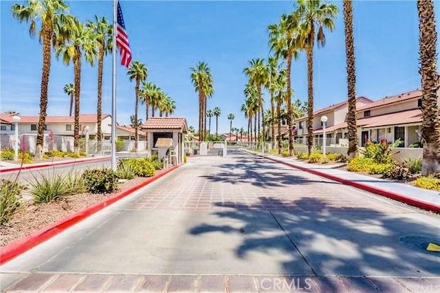 6105 Montecito Dr Unit 5, Palm Springs, CA 92264 - view of street with curbs, a residential view, and sidewalks