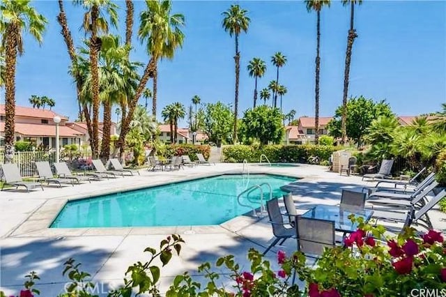 6105 Montecito Dr Unit 5, Palm Springs, CA 92264 - community pool with a patio area