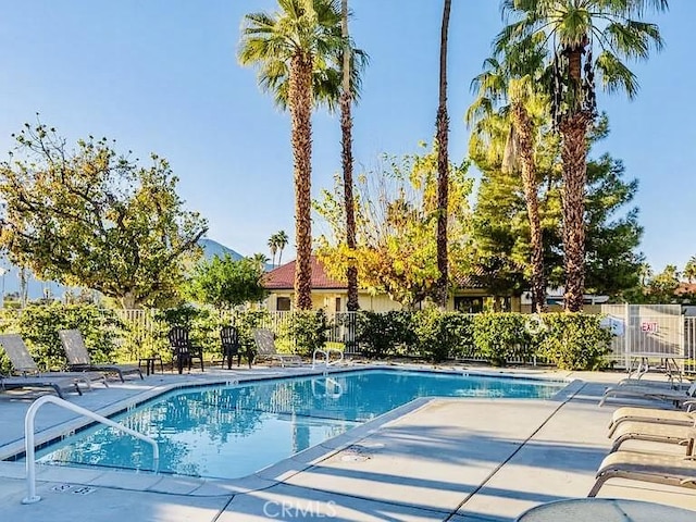6105 Montecito Dr Unit 5, Palm Springs, CA 92264 - community pool featuring a patio area