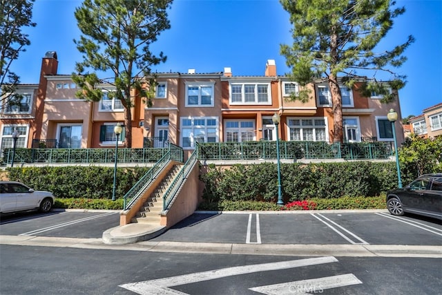 5 Arese Aisle, Irvine, CA 92606 - view of property with uncovered parking and stairway
