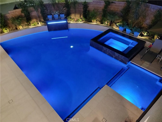 20042 W Mersey Ln, Porter Ranch, CA 91326 - view of swimming pool featuring a pool with connected hot tub