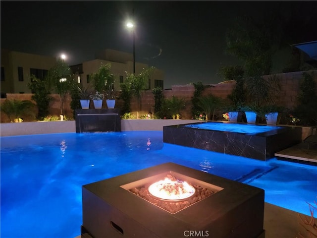 20042 W Mersey Ln, Porter Ranch, CA 91326 - pool at twilight featuring a fire pit