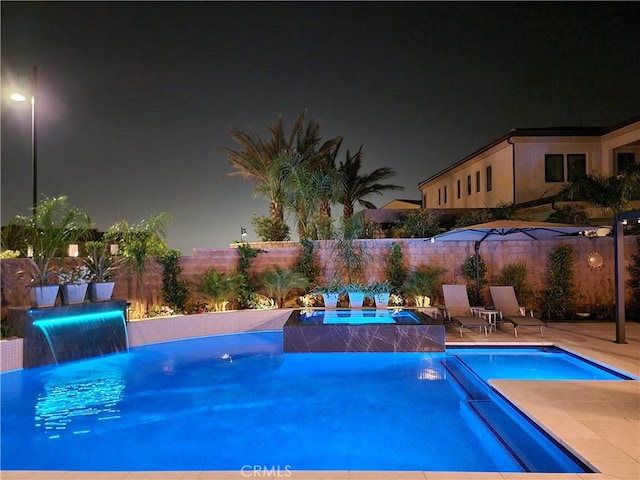 20042 W Mersey Ln, Porter Ranch, CA 91326 - pool at twilight featuring an in-ground hot tub