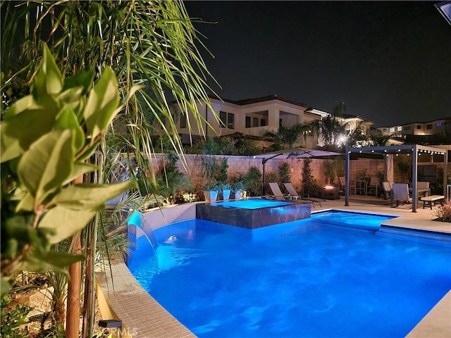 20042 W Mersey Ln, Porter Ranch, CA 91326 - pool at twilight with a patio area and an in-ground hot tub