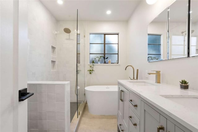 5923 Abernathy Dr, Los Angeles, CA 90045 - bathroom featuring double vanity, a tile shower, a freestanding tub, recessed lighting, and tile patterned flooring