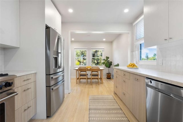 5923 Abernathy Dr, Los Angeles, CA 90045 - kitchen with stainless steel appliances, light countertops, light wood-style floors, healthy amount of natural light, and recessed lighting