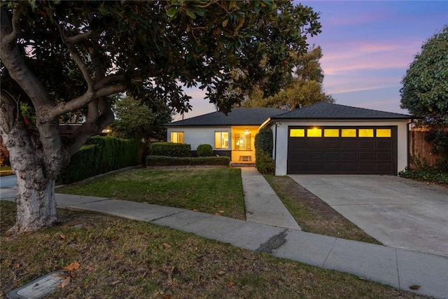 5923 Abernathy Dr, Los Angeles, CA 90045 - view of front of home with stucco siding, a yard, driveway, and an attached garage