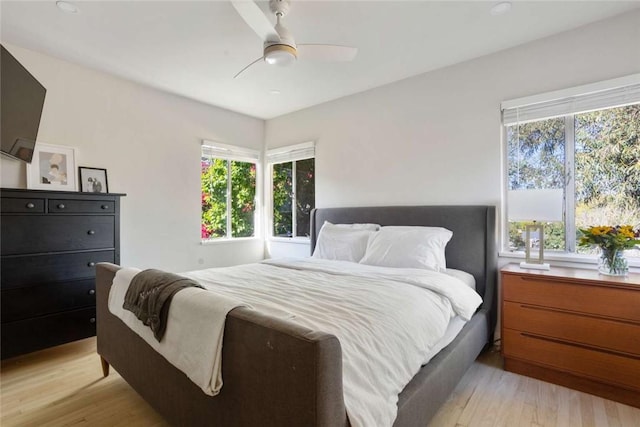 5923 Abernathy Dr, Los Angeles, CA 90045 - bedroom with light wood finished floors, multiple windows, and a ceiling fan