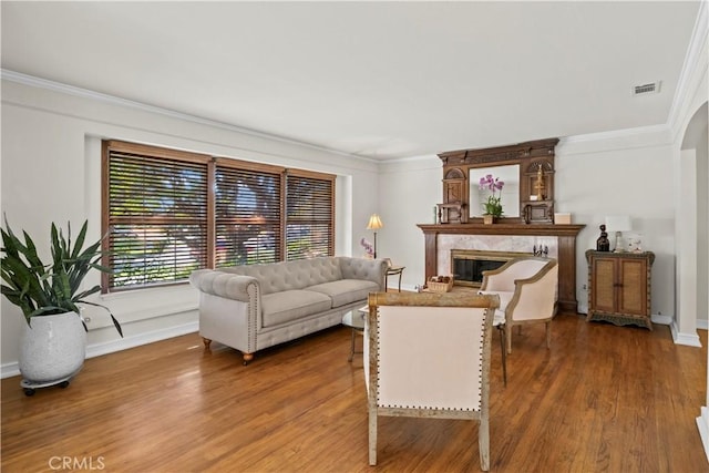 13232 Lorca Rd, La Mirada, CA 90638 - living room with ornamental molding, a fireplace, and wood finished floors