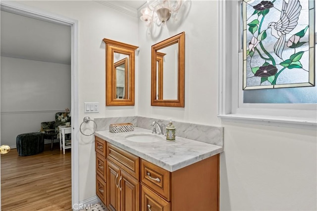13232 Lorca Rd, La Mirada, CA 90638 - bathroom with vanity, crown molding, and wood finished floors
