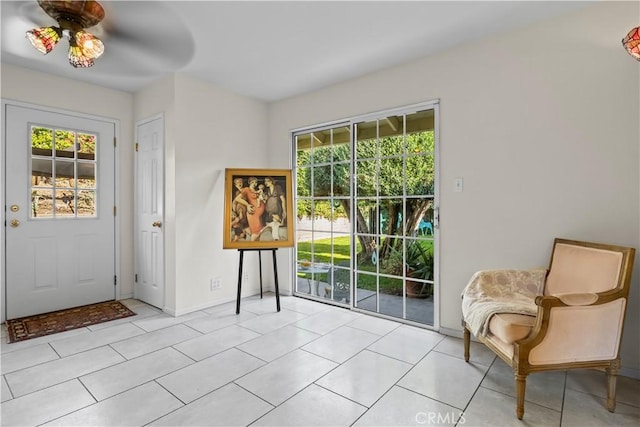 13232 Lorca Rd, La Mirada, CA 90638 - foyer entrance with healthy amount of natural light, light tile patterned floors, and ceiling fan