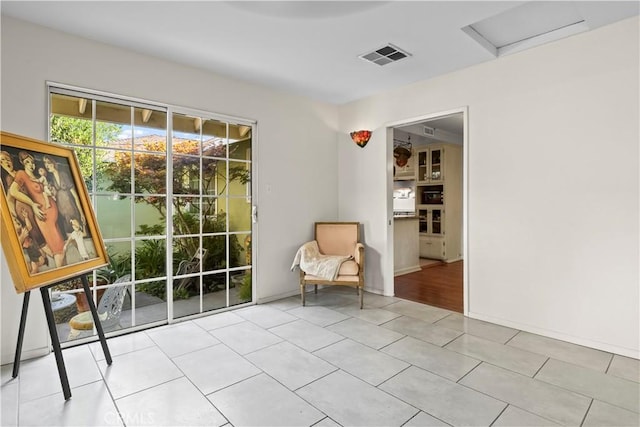 13232 Lorca Rd, La Mirada, CA 90638 - sitting room featuring attic access and light tile patterned floors