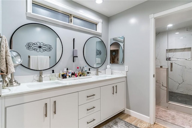 95 Buckskin Rd, Bell Canyon, CA 91307 - full bathroom with a marble finish shower, double vanity, wood finished floors, and recessed lighting