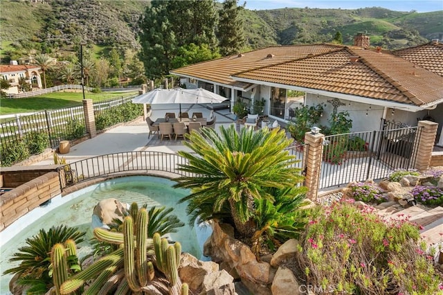 95 Buckskin Rd, Bell Canyon, CA 91307 - view of swimming pool featuring a fenced backyard, a patio, a mountain view, and outdoor dining area
