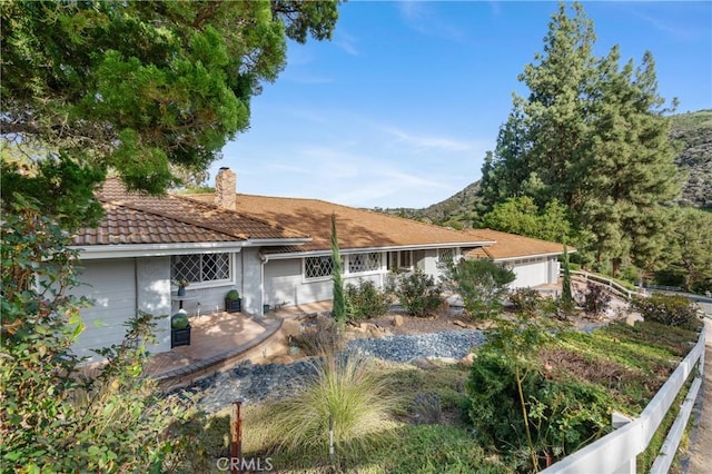 95 Buckskin Rd, Bell Canyon, CA 91307 - rear view of house with a chimney and a tiled roof