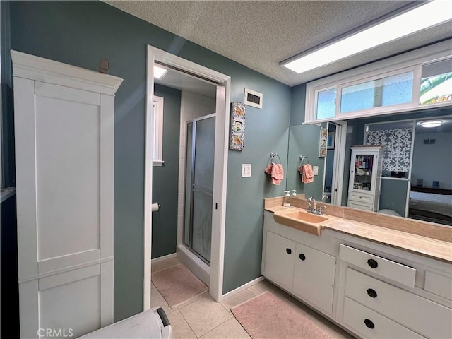 22709 Elm Ave, Torrance, CA 90505 - full bath with a stall shower, vanity, tile patterned floors, and a textured ceiling