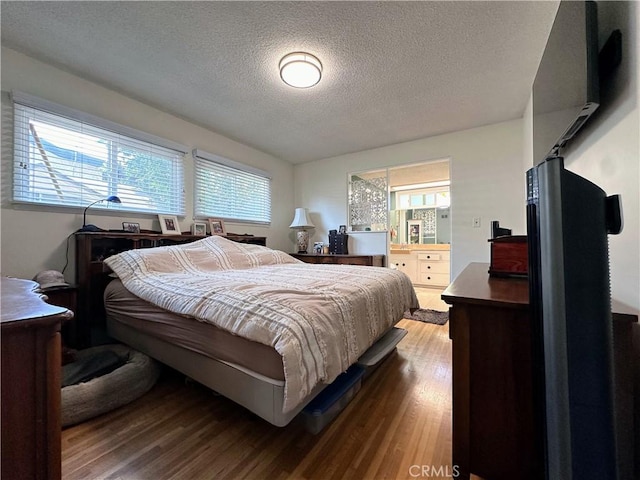 22709 Elm Ave, Torrance, CA 90505 - bedroom with wood finished floors and a textured ceiling