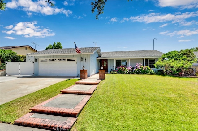 1428 N Erin Ave, Upland, CA 91786 - view of front of house featuring a garage, a front yard, driveway, and a gate