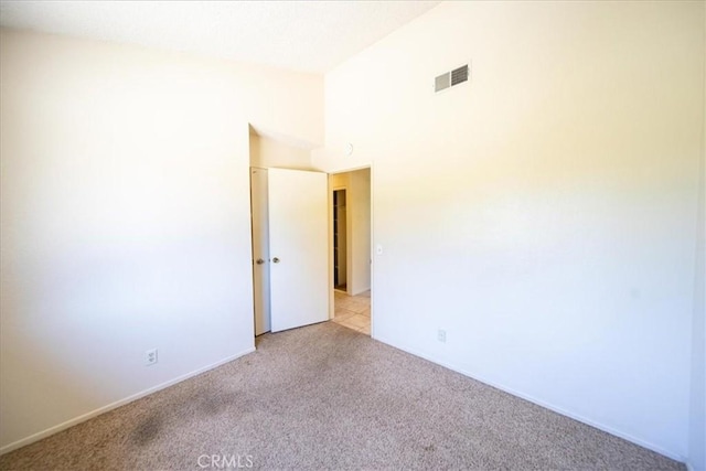 42205 Rubicon Cir, Temecula, CA 92591 - empty room with light carpet and high vaulted ceiling