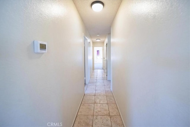 42205 Rubicon Cir, Temecula, CA 92591 - corridor with light tile patterned floors and a textured ceiling