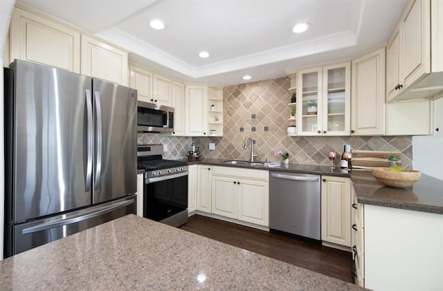 2535 Jefferson St Unit 10, Carlsbad, CA 92008 - kitchen featuring stainless steel appliances, cream cabinetry, a tray ceiling, open shelves, and crown molding