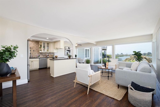 2535 Jefferson St Unit 10, Carlsbad, CA 92008 - living room featuring dark wood finished floors, arched walkways, recessed lighting, and a water view