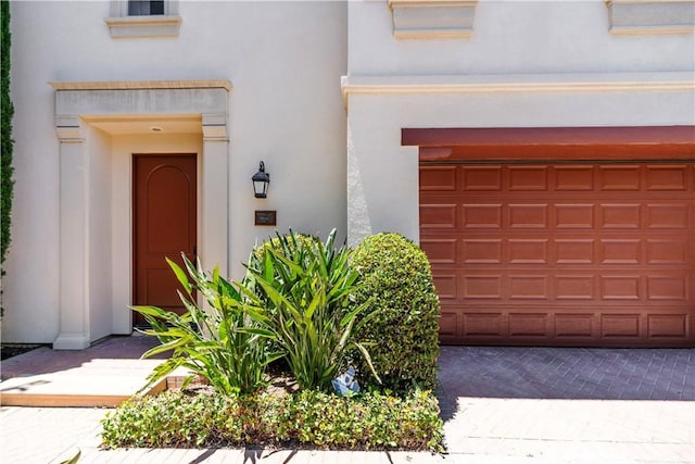 320 Bronze, Irvine, CA 92618 - view of exterior entry featuring stucco siding and driveway