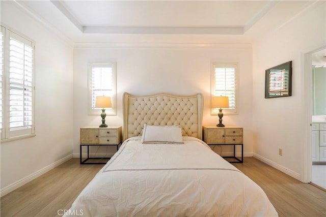 320 Bronze, Irvine, CA 92618 - bedroom featuring light wood-style flooring, multiple windows, and a tray ceiling