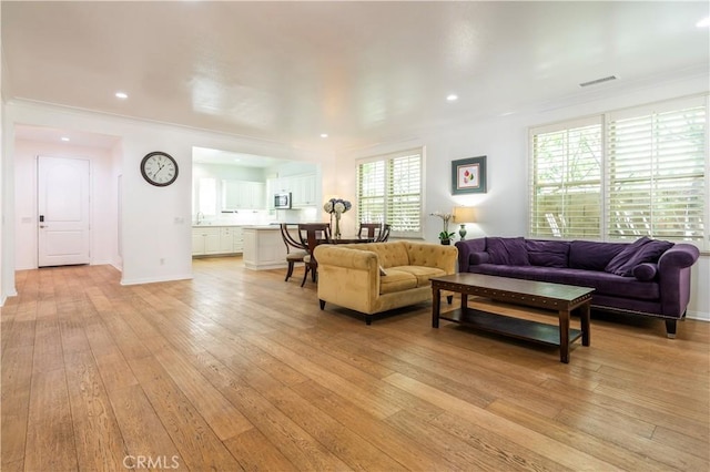 320 Bronze, Irvine, CA 92618 - living area with crown molding, light wood-style floors, and recessed lighting