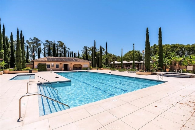 320 Bronze, Irvine, CA 92618 - community pool with a patio area, a community hot tub, and view of wooded area