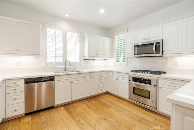 320 Bronze, Irvine, CA 92618 - kitchen featuring stainless steel appliances, white cabinetry, recessed lighting, and light countertops