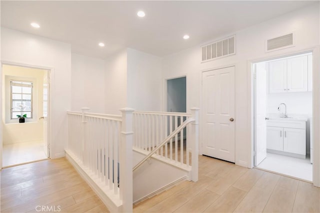 320 Bronze, Irvine, CA 92618 - corridor featuring an upstairs landing, light wood-style flooring, and recessed lighting