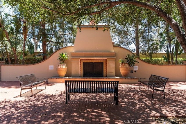 320 Bronze, Irvine, CA 92618 - view of patio / terrace with exterior fireplace